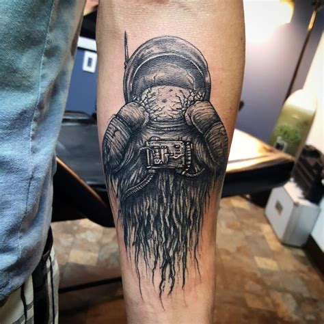 Dead Astronaut smashing helmet by Cameron Scott: TattooNOW