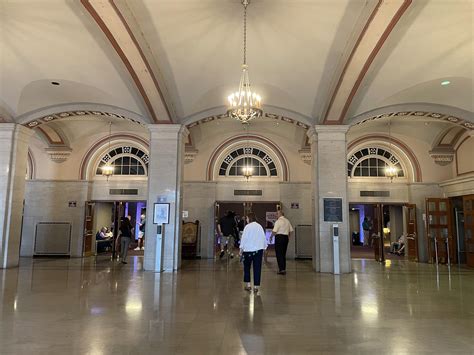 Photo of the Soldiers & Sailors Memorial Auditorium atrium, with a grand chandelier and three ...