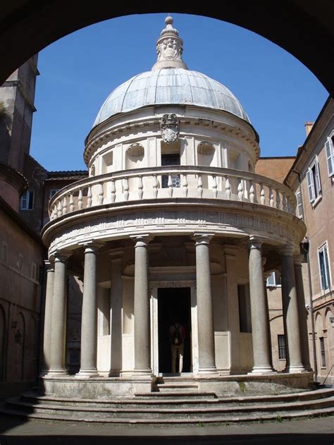 an old building with columns and a dome