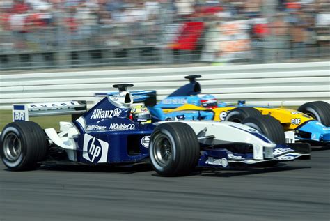 Juan Pablo Montoya overtakes Fernando Alonso's Renault at the 2003 German GP, Hockenheim ...