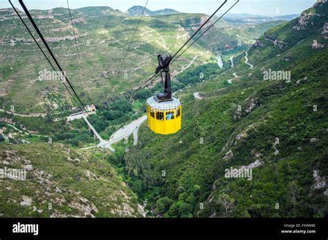 aerial cable car to Benedictine abbey Santa Maria de Montserrat on Montserrat mountain in ...