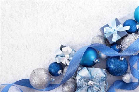 Free Photo | Christmas ornaments with a blue ribbon