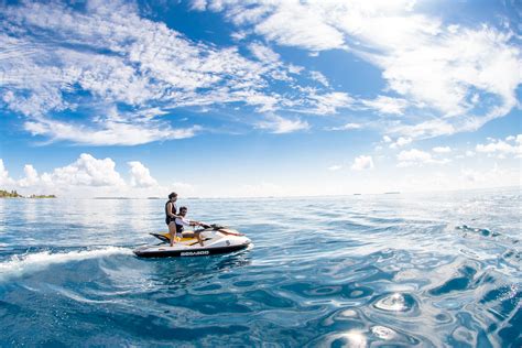 Two People Riding On Jet Ski · Free Stock Photo