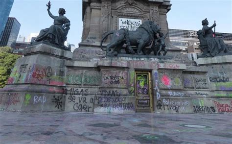 Protesters deface iconic Angel of Independence with graffiti in Mexico ...