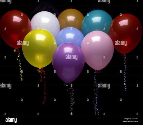 GROUP OF PARTY BALLOONS ON BLACK BACKGROUND Stock Photo - Alamy