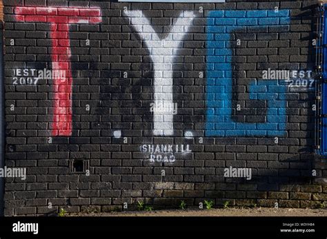 Loyalist flags and Tennent Street Young Guns gang banners in the Shankhill area of Belfast ...