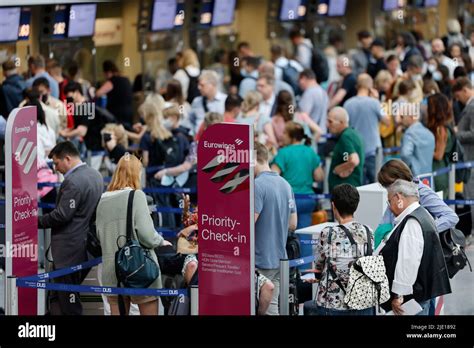 Duesseldorf, Germany. 24th June, 2022. Passengers line up at the ...