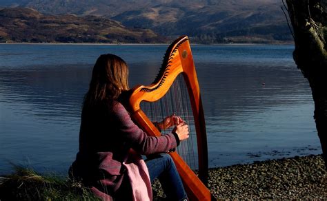 Clarsach player by sea, credit Christine Martin, Scotland's Music CROPPED and straightened ...