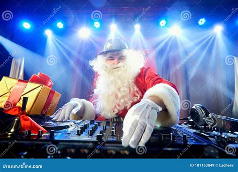 Funny Santa DJ Mixes in the Beams of Light Music. Stock Image - Image of music, people: 101163849