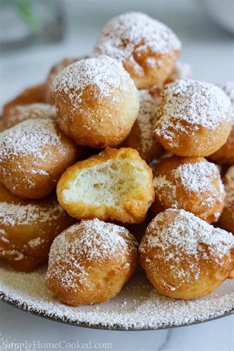 Close up of a pile of Zeppoles dusted with powdered sugar. | Zeppole recipe, Italian donuts ...