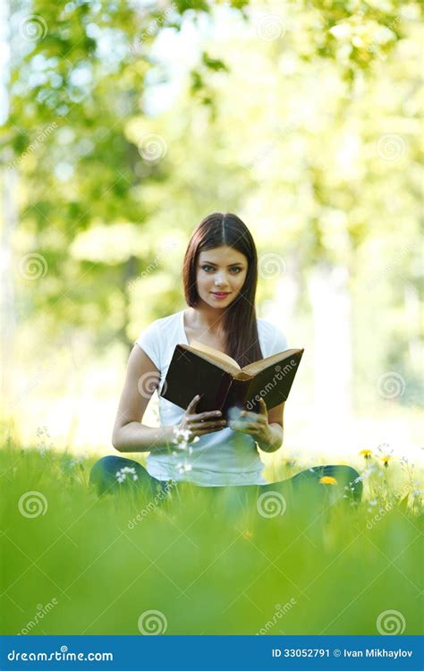 Woman Reading Book Outdoors Stock Image - Image of student, brunette: 33052791