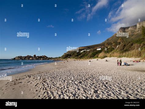 People watching the sunset on Llandudno beach, Cape Town Stock Photo - Alamy