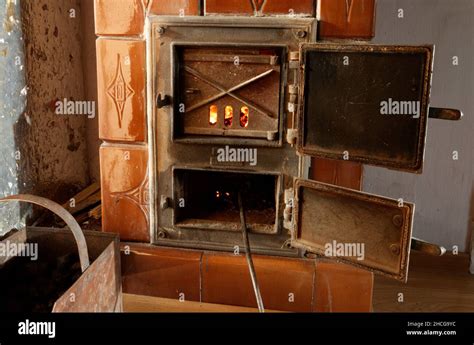 Traditional coal-fired heating furnace with decorative doors Stock ...