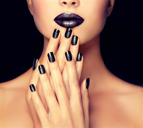 Premium Photo | Beautiful girl is showing black manicure on the nails in front of well shaped ...