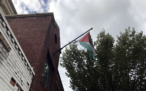 Protesters decry the offical closing of PLO Mission, as flag comes down ...