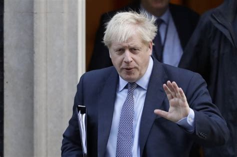 Johnson resigns, remains UK prime minister for now - WHYY