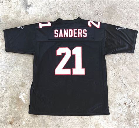 √ Deion Sanders Autographed Jersey