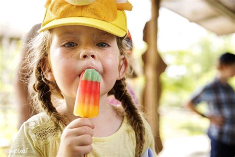 Download premium image of Young caucasian girl eating ice cream We are | Eating ice cream ...