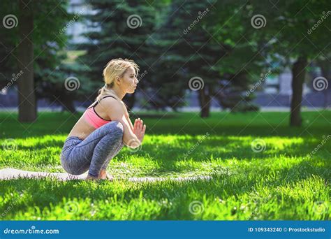 Woman Training Yoga in Regular Squat Pose . Stock Photo - Image of pose, girl: 109343240