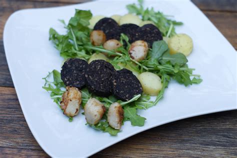 Scallops and Black Pudding with Rocket and New Potatoes and a Pesto Dressing