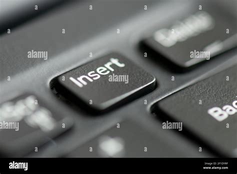 Insert key on a laptop keyboard Stock Photo - Alamy