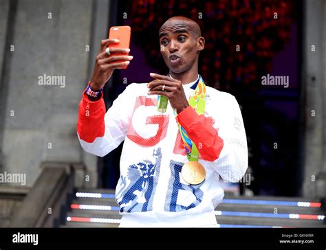 Great Britain's Mo Farah with his gold medals for victory in the Men's ...