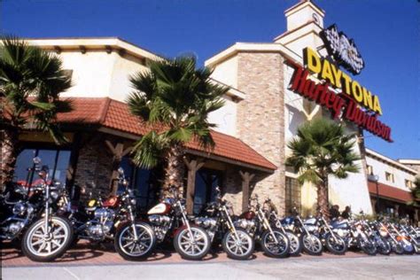 motorcycles are parked in front of a store