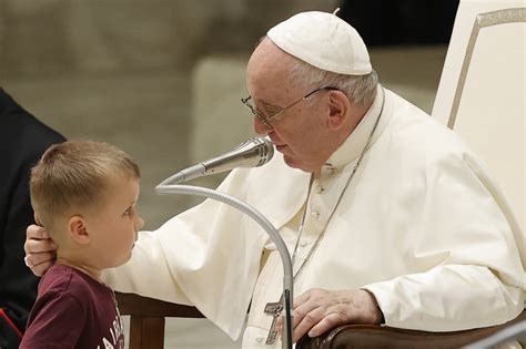 Young boy rushes stage to greet Pope Francis