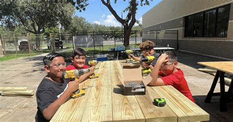 Driscoll Middle School students spend their Saturday building picnic tables