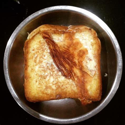 Homemade cheese bread. Ing: cheese, bread, butter. Method: put some butter, fry two slices of ...