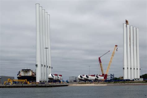 Wind turbine blades and towers at Global... © Julian Paren cc-by-sa/2.0 ...