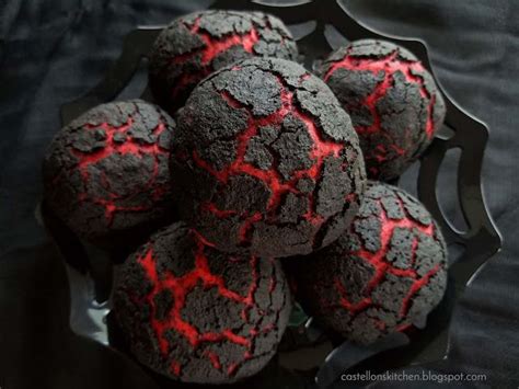 some black and red cookies in a metal bowl