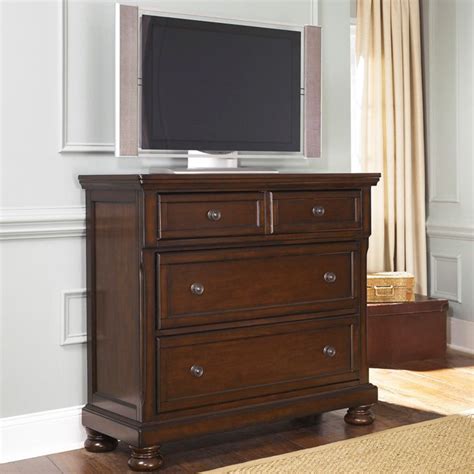 Ashley Porter Media Chest - The warm rustic beauty of the Porter bedroom collection uses a deep ...