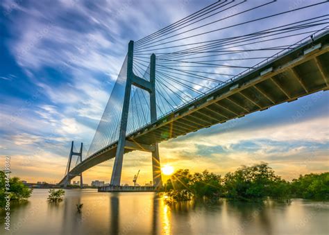 Beautiful sunset landscape at Phu My Bridge. This largest cable-stayed bridge crossing Saigon ...