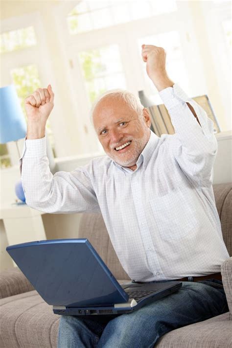 Happy Old Man Sitting On Sofa With Laptop Stock Photo - Image: 27720792