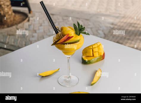 Daiquiri Mango Cocktail decorated with mango fruit Stock Photo - Alamy