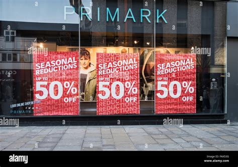 Half price or less sale signs in Primark window Stock Photo - Alamy