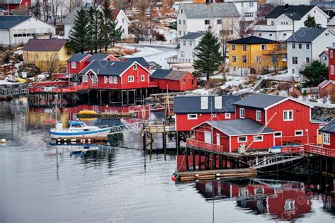 Reine Fishing Village On Lofoten Islands With Red Rorbu Houses In Winter With Snow Lofoten ...