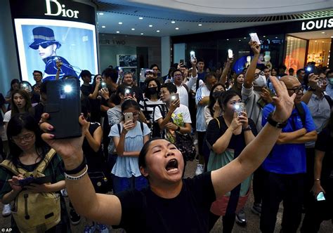 Hong Kong demonstrators belt out unofficial national anthem during face ...