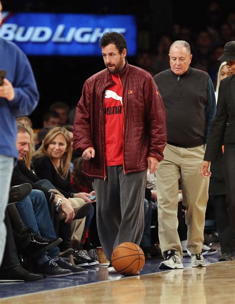 NEW YORK, NY - DECEMBER 08: Adam Sandler takes in the game between the New York Knicks and the ...