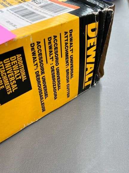 DEWALT UNIVERSAL BRUSH CUTTER ATTACHMENT IN BOX - Earl's Auction Company