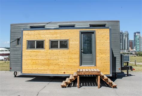 Expanding Tiny House on Wheels with Huge Slide Outs: Expands with the Touch of a Button!