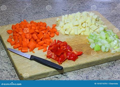 Diced or Chopped Vegetables on a Wooden Board. Stock Photo - Image of ...