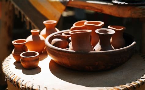 Premium Photo | Simple homemade clay crafts jugs and cups outdoors on a ...