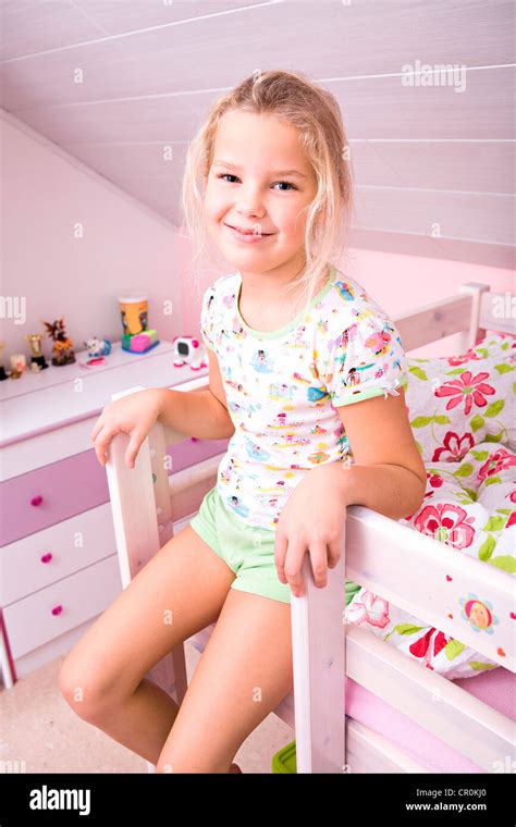 Little girl in bed, getting up Stock Photo - Alamy