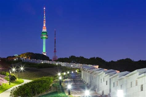 Premium Photo | Seoul tower at night view and old wall with light ...