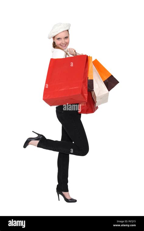 Happy woman returning from shopping trip Stock Photo - Alamy