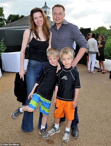 Elon Musk is pictured for the first time with Neuralink director Shivon ...