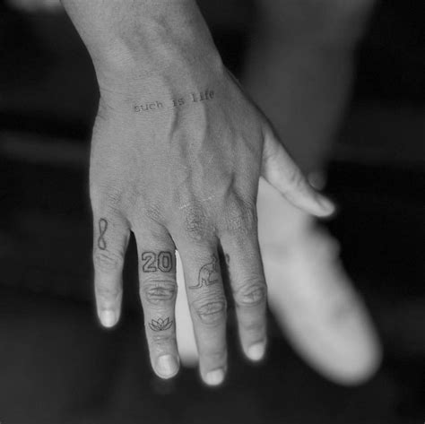 Fine line tattoos located on Sam Kerr's fingers.