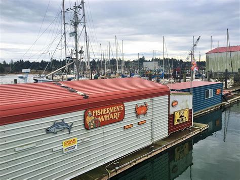 there are many boats that are docked at the dock in the water and one ...